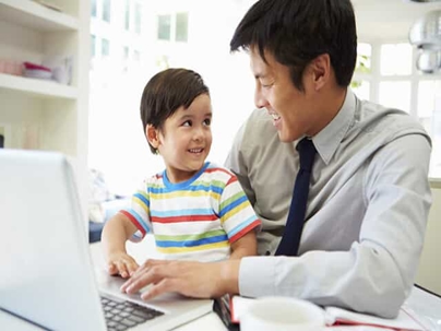 Man playing with son on a computer
