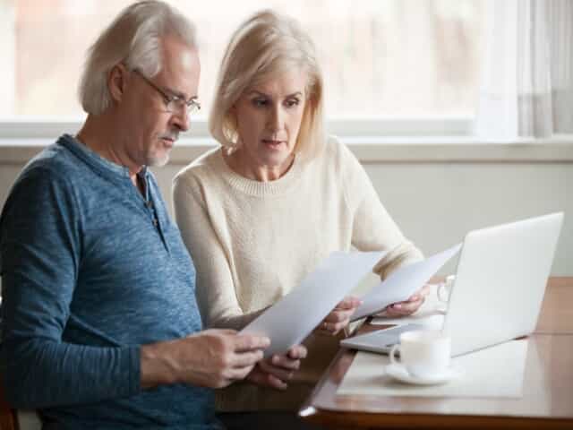 Senior couple looking at papers